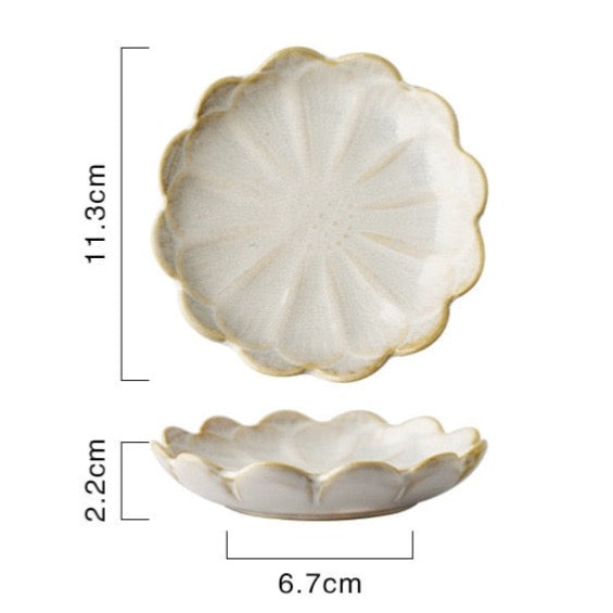 Cream colored flower shaped ceramic snack dish