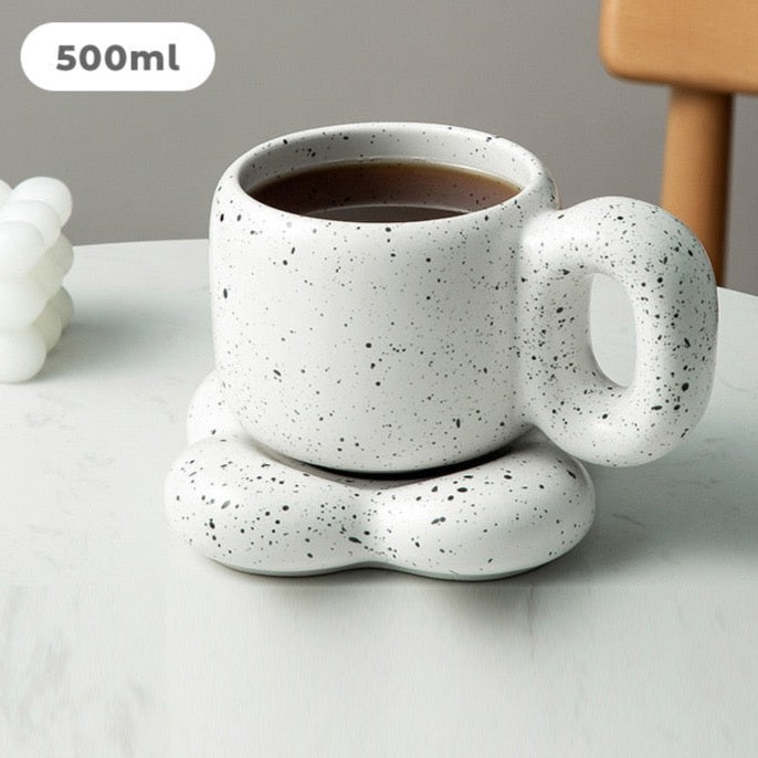 White, black speckled chunky handle ceramic mug with matching plate